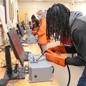 A class uses the VR Welding Simulator