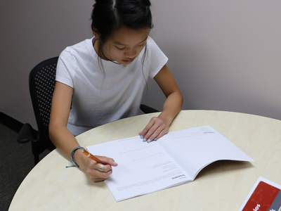 Student using workbooks