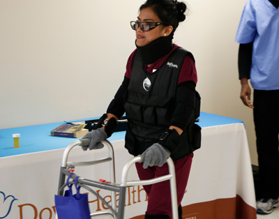 Student using Realityworks Geriatric Simulator