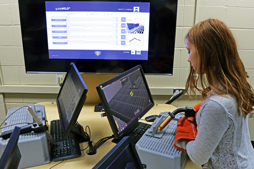 Female student using guideWELD VR