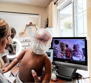 Teacher using Shaken Baby to teach a lesson on child abuse prevention remotely