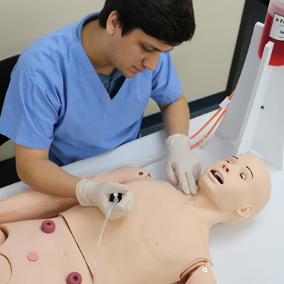 Student using Realityworks' Nursing Manikin