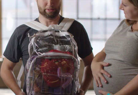 Student wearing backpack backwards