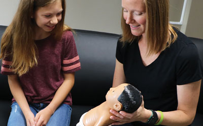 Student with Realityworks' Down Syndrome Baby