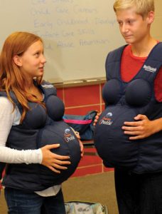 Students wearing Realityworks' Pregnancy Profile 2.0 Simulator