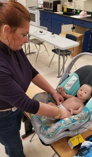 Teacher using RealCare Baby