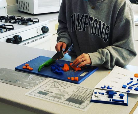Student using Realityworks' Kitchen Safety Kit