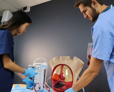 Health care students using Realityworks' Chest Tube Management Simulator