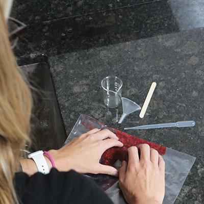 Woman using food science kit