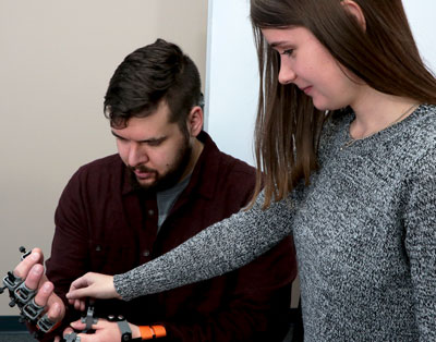Students using Realityworks' CNA Skills Sim Kit