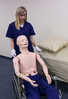Student using Geriatric Manikin