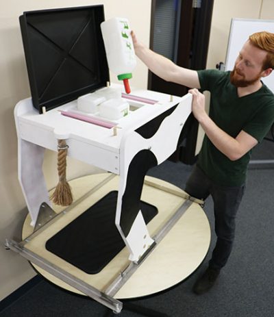 Teacher using the Milking Udder Simulator