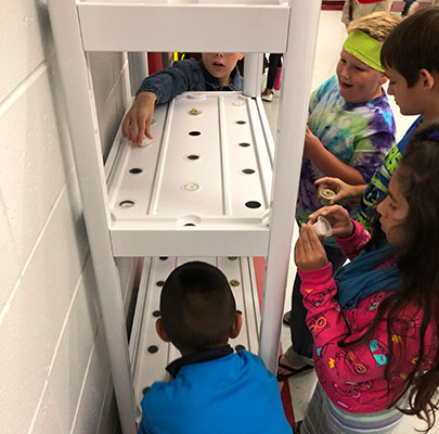 Hydroponics class students checking out the system