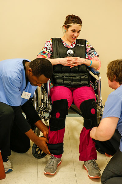 Student in wheelchair wearing Geriatric Simulation