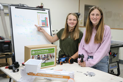 Students who completed a tractor pull competition