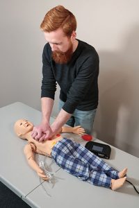Student using Pediatric Nursing Manikin In Scenario