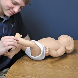 A student studies the Birth Defects Baby's clubfoot
