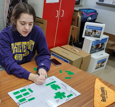 Students using Realityworks' Child Care Center Design Kit